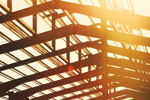 Steel vs. Wood Roof Trusses: Comparing Strength, Longevity, and Environmental Impact